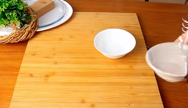 Two bowls on a wooden work surface