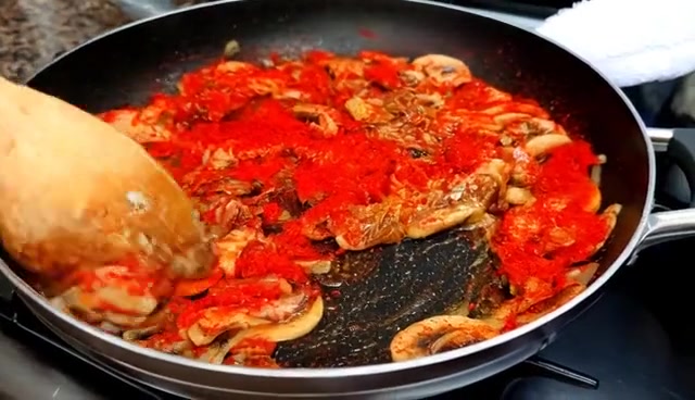 Ingredients being stirred in a frying pan